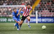 4 July 2025; Michael Duffy of Derry City in action against Rowan McDonald of Waterford during the SSE Airtricity Men's Premier Division match between Derry City and Waterford at The Ryan McBride Brandywell Stadium in Derry. Photo by Ramsey Cardy/Sportsfile