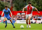 4 July 2025; Simon Power of St Patrick's Athletic in action against Keith Buckley of Bohemians during the SSE Airtricity Men's Premier Division match between St Patrick's Athletic and Bohemians at Richmond Park in Dublin. Photo by Thomas Flinkow/Sportsfile