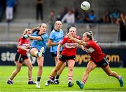 5 July 2025; Niamh Donlon of Dublin in action against Rosie Corkery of Cork during the TG4 All-Ireland Ladies Football Senior Championship quarter-final match between Dublin and Cork at Parnell Park in Dublin. Photo by Seb Daly/Sportsfile