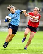 5 July 2025; Niamh Crowley of Dublin in action against Melissa Duggan of Cork during the TG4 All-Ireland Ladies Football Senior Championship quarter-final match between Dublin and Cork at Parnell Park in Dublin. Photo by Seb Daly/Sportsfile