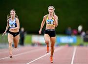 5 July 2025; Lucy-May Sleeman of Leevale AC, Cork, right, on her way to winning the U23 women 100m during the 123.ie National U20 & U23 Championships at Tullamore Harriers Athletics Club in Tullamore, Offaly. Photo by Sam Barnes/Sportsfile