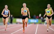 5 July 2025; Lucy-May Sleeman of Leevale AC, Cork, centre, on her way to winning the U23 women 100m during the 123.ie National U20 & U23 Championships at Tullamore Harriers Athletics Club in Tullamore, Offaly. Photo by Sam Barnes/Sportsfile
