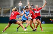 5 July 2025; Kate Sullivan of Dublin in action against Cork players Máire O'Callaghan, left, and Sarah Leahy during the TG4 All-Ireland Ladies Football Senior Championship quarter-final match between Dublin and Cork at Parnell Park in Dublin. Photo by Seb Daly/Sportsfile