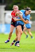 5 July 2025; Sinéad Goldrick of Dublin is tackled by Melissa Duggan of Cork during the TG4 All-Ireland Ladies Football Senior Championship quarter-final match between Dublin and Cork at Parnell Park in Dublin. Photo by Seb Daly/Sportsfile