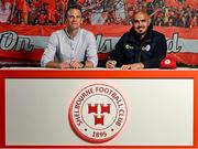 5 July 2025; Shelbourne head coach Joey O'Brien signs his contract alongside chief executive officer Tomás Quinn at Tolka Park in Dublin. Photo by David Fitzgerald/Sportsfile