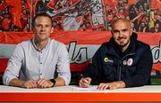 5 July 2025; Shelbourne head coach Joey O'Brien signs his contract alongside chief executive officer Tomás Quinn at Tolka Park in Dublin. Photo by David Fitzgerald/Sportsfile