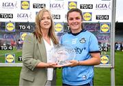 5 July 2025; Kate Sullivan of Dublin receives the Player of the Match Award from Helen O’Rourke, LGFA CEO, after the 2025 TG4 All-Ireland Senior Championship Quarter-Final between Dublin and Cork at Parnell Park, Dublin. Photo by Seb Daly/Sportsfile