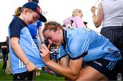 5 July 2025; Orlagh Nolan of Dublin signs a young supporters jersey after the TG4 All-Ireland Ladies Football Senior Championship quarter-final match between Dublin and Cork at Parnell Park in Dublin. Photo by Seb Daly/Sportsfile