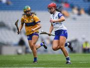 5 July 2025; Eimear O'Neill of Waterford in action against Abby Walsh of Clare during the Glen Dimplex Senior All-Ireland Camogie Championship quarter-final match between Clare and Waterford at Croke Park in Dublin. Photo by John Sheridan/Sportsfile