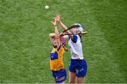 5 July 2025; Andrea O'Keeffe of Clare in action against Mairéad O'Brien of Waterford during the Glen Dimplex Senior All-Ireland Camogie Championship quarter-final match between Clare and Waterford at Croke Park in Dublin. Photo by Stephen McCarthy/Sportsfile
