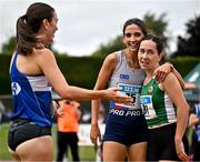 5 July 2025; Eimear Maher of Dundrum South Dublin AC, centre, is congratulated by Cara Laverty of Finn Valley AC, Donegal, left, and Holly Carroll of Blarney/Inniscara AC, Cork, right, after winning the U23 women 1500m during the 123.ie National U20 & U23 Championships at Tullamore Harriers Athletics Club in Tullamore, Offaly. Photo by Sam Barnes/Sportsfile