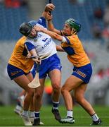 5 July 2025; Abby Flynn of Waterford is tackled by /Niamh Mulqueen, right, and Danielle Griffin of Clare during the Glen Dimplex Senior All-Ireland Camogie Championship quarter-final match between Clare and Waterford at Croke Park in Dublin. Photo by Ray McManus/Sportsfile