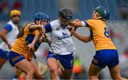 5 July 2025; Abby Flynn of Waterford is tackled by /Niamh Mulqueen, 8, and Danielle Griffin of Clare during the Glen Dimplex Senior All-Ireland Camogie Championship quarter-final match between Clare and Waterford at Croke Park in Dublin. Photo by Ray McManus/Sportsfile