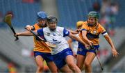 5 July 2025; Abby Flynn of Waterford is tackled by /Niamh Mulqueen, right, and Danielle Griffin of Clare during the Glen Dimplex Senior All-Ireland Camogie Championship quarter-final match between Clare and Waterford at Croke Park in Dublin. Photo by Ray McManus/Sportsfile