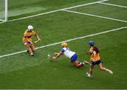 5 July 2025; Niamh Rockett of Waterford shoots to score her side's second goal past Clare goalkeeper Rachael Daly during the Glen Dimplex Senior All-Ireland Camogie Championship quarter-final match between Clare and Waterford at Croke Park in Dublin. Photo by Stephen McCarthy/Sportsfile