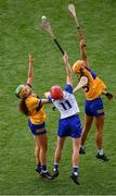 5 July 2025; Beth Carton of Waterford in action against Abby Walsh, left, and Lynda Daly of Clare during the Glen Dimplex Senior All-Ireland Camogie Championship quarter-final match between Clare and Waterford at Croke Park in Dublin. Photo by Stephen McCarthy/Sportsfile
