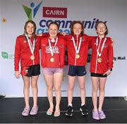 5 July 2025; Members of the Cork under-13 relay team, from Douglas, from left, Una Casey, Mila Devitt, Lauren Jankowska and Eimear Burke during day one of the Cairn Community Games National Swimming, Quiz, Chess, Draughts and Gymnastics Finals 2025 at The Watershed in Kilkenny. Photo by Matt Browne/Sportsfile
