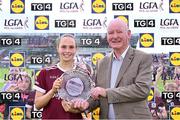 5 July 2025; Olivia Divilly of Galway receives the Player of the Match award from Brendan Cregg, LGFA Vice-President, following the 2025 TG4 All-Ireland Senior Championship quarter-final match between Galway and Waterford at Tuam Stadium in Galway. Photo by Piaras Ó Mídheach/Sportsfile