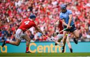 5 July 2025; John Hetherton of Dublin is blocked by Seán O'Donoghue of Cork during the GAA Hurling All-Ireland Senior Championship semi-final match between Cork and Dublin at Croke Park in Dublin. Photo by Ramsey Cardy/Sportsfile
