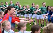 5 July 2025; Players from the half-time mini games, including from Dunmore MacHales in green, await the arrival of the Galway players before the TG4 All-Ireland Ladies Football Senior Championship quarter-final match between Galway and Waterford at Tuam Stadium in Galway. Photo by Piaras Ó Mídheach/Sportsfile