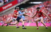 5 July 2025; Fergal Whitely of Dublin in action against Mark Coleman, left, and Robert Downey of Cork during the GAA Hurling All-Ireland Senior Championship semi-final match between Cork and Dublin at Croke Park in Dublin. Photo by Ramsey Cardy/Sportsfile