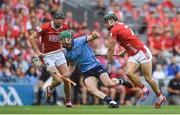 5 July 2025; Fergal Whitely of Dublin in action against Cork players, from left, Robert Downey and Mark Coleman during the GAA Hurling All-Ireland Senior Championship semi-final match between Cork and Dublin at Croke Park in Dublin. Photo by John Sheridan/Sportsfile