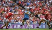 5 July 2025; Cian O'Sullivan of Dublin is tackled by Cork players, from left, Seán O'Donoghue and Ciarán Joyce during the GAA Hurling All-Ireland Senior Championship semi-final match between Cork and Dublin at Croke Park in Dublin. Photo by John Sheridan/Sportsfile