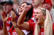 5 July 2025; Cork supporters celebrate during the GAA Hurling All-Ireland Senior Championship semi-final match between Cork and Dublin at Croke Park in Dublin. Photo by Ramsey Cardy/Sportsfile