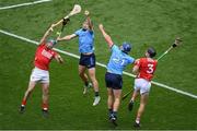 5 July 2025; Seán O'Donoghue, left, and Eoin Downey of Cork in action against Ronan Hayes and John Hetherton, right, of Dublin during the GAA Hurling All-Ireland Senior Championship semi-final match between Cork and Dublin at Croke Park in Dublin. Photo by Stephen McCarthy/Sportsfile