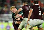 5 July 2025; Jamie Osborne of Ireland is tackled by Luka Ivanishvili of Georgia during the International Rugby Test match between Georgia and Ireland at at Mikheil Meskhi Stadium in Tbilisi, Georgia. Photo by Brendan Moran/Sportsfile