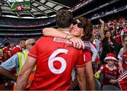 5 July 2025; Robert Downey of Cork celebrates with his mother Angela after the GAA Hurling All-Ireland Senior Championship semi-final match between Cork and Dublin at Croke Park in Dublin. Photo by David Fitzgerald/Sportsfile