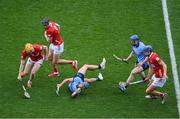5 July 2025; Riain McBride with the support of his Dublin team-mate Conor Burke, right, in action against Shane Barrett, left, Darragh Fitzgibbon, 9, and Diarmuid Healy of Cork during the GAA Hurling All-Ireland Senior Championship semi-final match between Cork and Dublin at Croke Park in Dublin. Photo by Stephen McCarthy/Sportsfile