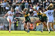 5 July 2025; Aoife Rattigan of Kildare kicks a point despite pressure from Niamh Ní Chonchúir of Kerry during the TG4 All-Ireland Ladies Football Senior Championship quarter-final match between Kerry and Kildare at Austin Stack Park in Tralee, Kerry. Photo by Tyler Miller/Sportsfile