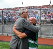5 July 2025; Irish Exminer photographer Eddie O'Hare, who retired after today's game having served the paper for more than 47 years, is photographed with the Uachtarán Chumann Lúthchleas Gael Jarlath Burns before the GAA Hurling All-Ireland Senior Championship semi-final match between Cork and Dublin at Croke Park in Dublin. Photo by Ray McManus/Sportsfile