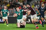 5 July 2025; Jamie Osborne of Ireland is tackled by Luka Ivanishvili and Beka Saghinadze of Georgia during the International Rugby Test match between Georgia and Ireland at at Mikheil Meskhi Stadium in Tbilisi, Georgia. Photo by Brendan Moran/Sportsfile