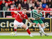 5 July 2025; Ryan O'Kane of Sligo Rovers in action against Danny Grant of Shamrock Rovers during the SSE Airtricity Men's Premier Division match between Sligo Rovers and Shamrock Rovers at The Showgrounds in Sligo. Photo by Thomas Flinkow/Sportsfile