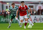 5 July 2025; Ryan O'Kane of Sligo Rovers in action against Danny Grant of Shamrock Rovers during the SSE Airtricity Men's Premier Division match between Sligo Rovers and Shamrock Rovers at The Showgrounds in Sligo. Photo by Thomas Flinkow/Sportsfile