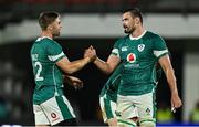 5 July 2025; Jack Crowley, left, and Max Deegan of Ireland celebrate at the final whistle of the International Rugby Test match between Georgia and Ireland at at Mikheil Meskhi Stadium in Tbilisi, Georgia. Photo by Brendan Moran/Sportsfile