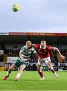 5 July 2025; Michael Noonan of Shamrock Rovers in action against Patrick McClean of Sligo Rovers during the SSE Airtricity Men's Premier Division match between Sligo Rovers and Shamrock Rovers at The Showgrounds in Sligo. Photo by Thomas Flinkow/Sportsfile