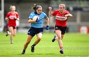 5 July 2025; Niamh Crowley of Dublin in action against Melissa Duggan of Cork during the TG4 All-Ireland Ladies Football Senior Championship quarter-final match between Dublin and Cork at Parnell Park in Dublin. Photo by Seb Daly/Sportsfile