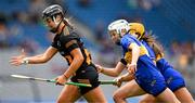 6 July 2025; Tiffanie Fitzgerald of Kilkenny is tackled by Clodagh McIntyre of Tipperary during the Glen Dimplex Senior All-Ireland Camogie Championship quarter-final match between Kilkenny and Tipperary at Croke Park in Dublin. Photo by Ray McManus/Sportsfile