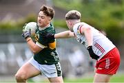 6 July 2025; Ben Kelliher of Kerry in action against Padraig Goodman of Tyrone during the Electric Ireland GAA Football All-Ireland Minor Championship final match between Kerry and Tyrone at Cedral St Conleth's Park in Newbridge, Kildare. Photo by Piaras Ó Mídheach/Sportsfile