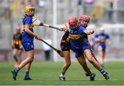 6 July 2025; Karen Kennedy of Tipperary is tackled by KellyAnn Doyle of Kilkenny during the Glen Dimplex Senior All-Ireland Camogie Championship quarter-final match between Kilkenny and Tipperary at Croke Park in Dublin. Photo by John Sheridan/Sportsfile