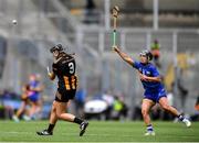 6 July 2025; Tiffanie Fitzgerald of Kilkenny gets a shot off despite the efforts of Grace O'Brien of Tipperary during the Glen Dimplex Senior All-Ireland Camogie Championship quarter-final match between Kilkenny and Tipperary at Croke Park in Dublin. Photo by John Sheridan/Sportsfile