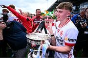 6 July 2025; Cathal Farley of Tyrone celebrates with supporter Charlie Kelly after the Electric Ireland GAA Football All-Ireland Minor Championship final match between Kerry and Tyrone at Cedral St Conleth's Park in Newbridge, Kildare. Photo by Piaras Ó Mídheach/Sportsfile