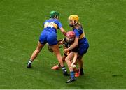6 July 2025; Laura Greene of Kilkenny in action against Casey Hennessy, left, and Eimear Heffernan of Tipperary during the Glen Dimplex Senior All-Ireland Camogie Championship quarter-final match between Kilkenny and Tipperary at Croke Park in Dublin. Photo by Daire Brennan/Sportsfile