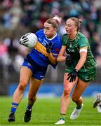 6 July 2025; Katelyn Downey of Tipperary in action against Aoibhín Cleary of Meath during the TG4 All-Ireland Ladies Football Senior Championship quarter-final match between Meath and Tipperary at Páirc Tailteann in Navan, Meath. Photo by Stephen Marken/Sportsfile