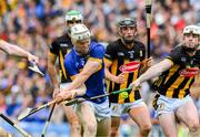 6 July 2025; Oisin O'Donoghue of Tipperary scores his side's 4th goal, in the 70th minute, despite the best efforts of Jordan Molloy of Kilkenny during the GAA Hurling All-Ireland Senior Championship semi-final match between Kilkenny and Tipperary at Croke Park in Dublin. Photo by Ray McManus/Sportsfile