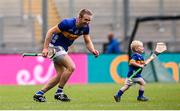 6 July 2025; Noel McGrath of Tipperary and his son Sam, age 2, in an empty stadium after the GAA Hurling All-Ireland Senior Championship semi-final match between Kilkenny and Tipperary at Croke Park in Dublin. Photo by Ramsey Cardy/Sportsfile