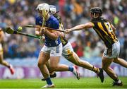 6 July 2025; Darragh McCarthy of Tipperary in action against Kilkenny players, from left, Richie Reid and Mikey Butler during the GAA Hurling All-Ireland Senior Championship semi-final match between Kilkenny and Tipperary at Croke Park in Dublin. Photo by John Sheridan/Sportsfile
